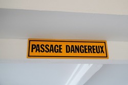Passage dangereux french text means dangerous passage in up yellow panel board