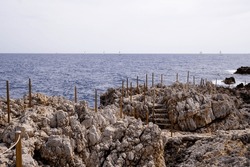 mediterranean sea rock pathway stone in summer south Antibes Juan-les-Pins France southeast