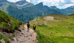 Two hiker women in path of Pic du Midi Ossau in the French Pyrenees mountains