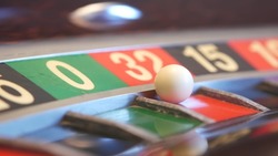 Ball on french roulette table in casino. Wheel spinning, turning or rotating. Odd and even numbers, black, red and zero sectors. Game of chance, money playing, gambling. Seamless looped cinemagraph.