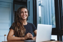 Happy smart woman working from home, freelancer using computer, work with laptop remote during self-quarantine, virus outbreak, stay safe and productive, learn new skills, development concept