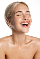 Dental care and beauty. Vertical of laughing happy woman with perfect white teeth, natural smile, glowing healthy facial skin, standing over white background