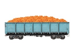 Blue metallic goods wagon or freight wagon with tangerines isolated on white. 
