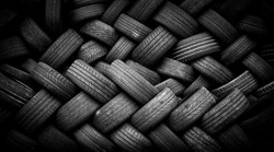 Pile of old tires neatly arranged.