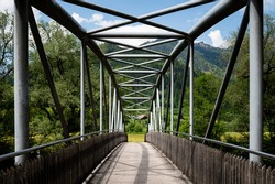 Small bridge across river Enns near Admont (Austria), sunny day in summer, blue sky