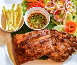 pork rib steak serve on plate / barbecue pork roast french fries fresh vegetable salad and chili sauce spicy - grill spare ribs honey dip