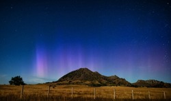 Aurora over the Bear Butte with northern lights