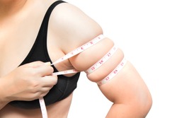Woman show and  squeeze tighten, arm body fat by measure tape or line tape wearing black underwear bra on white isolated