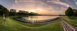 Panoramic view of Bedok Reservoir, Singapore during sunset hours. Photographed as composite images to form HDR Panorama in final image.