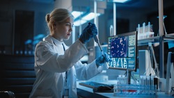 Medical Research Laboratory: Portrait of Female Scientist Working with Samples, using Micro Pipette Analysing Sample. Advanced Scientific Lab for Medicine, Biotechnology, Vaccine Development