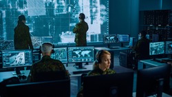 Military Surveillance Team of Officers Locked a Target on a Vehicle from a Satellite and Monitor it on a Big Display in Office for Cyber Operations for Managing Security and Army Communications.