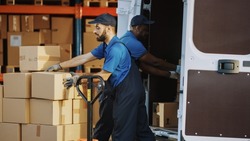 Outside of Logistics Distributions Warehouse: Diverse Team of Two Workers Talk, Joke Around Loading Delivery Truck with Cardboard Boxes, Online Orders, Medicine, Food Supply, E-Commerce Goods