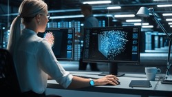 Technical Control Operator Woman Working at Her Workstation with Multiple Displays with Mock-up Green Screen. Possible Data Center Government Surveillance, Neural Network Program