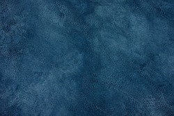 Vintage dark blue marble or concrete background (as an abstract blue background or marble or concrete texture)