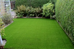 Newly laid artificial lawn in small front garden, East Yorkshire, UK