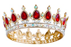 Golden crown with red and white diamonds.  Gold tiara for princess. Expensive jewelry. Decoration for king or queen, magic crown isolated on white background, close up              