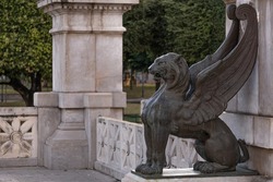Statue of a black lion with wings made of bronze