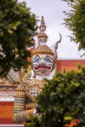 Guardian of Wat Arun. This intricate guardian statue stands proudly at the entrance of Wat Arun, a renowned Buddhist temple located in the Bangkok Yai district of Thailand's capital