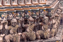Small guardians at Wat Arun Temple, representing the eternal devotion to Sahasadecha and Thosakan.These sculpted figures are silent witnesses to the rich Thai mythology that adorns this historic place