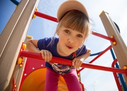 Active little girl on playground