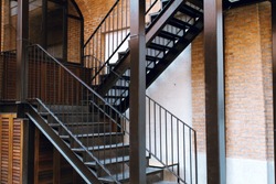 Modern design metal staircase with concrete building.