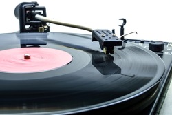 Retro party dj turntable to play music on vinyl audio disc.