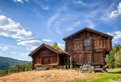 Old traditional Norwegian Stabbur elevated wooden store houses Telemark, Norway, Scandanavia