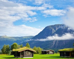 Wooden cabins with turf roof at a campsite in Norway