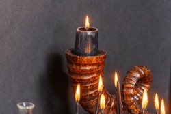 Black magic candles witchcraft composition. Magic ritual satanic tools and items. Halloween and occult black magic ritual imaginary. Ritual scene in dark and frightening atmosphere.