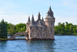 1000 Islands, Thousand Islands - June 19, 2016: Boldt Castle on Heart Island. Power house, New York State. Unfiltered, natural lighting. Tourist routs. St. Lawrence River, USA-Canada border.