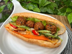 Banh mi A typical Vietnamese roll or sandwich is a fusion of meats and vegetables from native Vietnamese