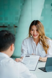 The job interviewer is giving advice. and read the application Applicants to the process of working within the company and work system for job applicants