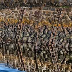 Chains and Ladders and their reflections in a n old fishing harbour on the Moray coast, Scotland