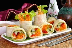 Vegetarian food : Hummus and vegetable wrapped with Tortillas. Tortillas-Hummus Fresh spring rolls , selective focus.