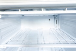 domestic fridge freezer defrost problem concept. refrigerator covered with ice. appliance repair concept.