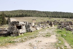 ruins of archaeological site Hierapolis in Turkey - road among the old tombs of Necropolis