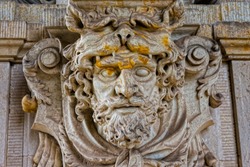 Sculptural decoration (the face of Hercules - a hero from Greek mythology) in the Zwinger Palace (built at the beginning of the 18th century) in Dresden, Germany.