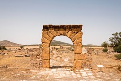 Entrance archway to the Temple of Caelestis at the archaeological site of the ancient Roman Tuburbo Majus, near the modern city of El Fahs, Tunisia.