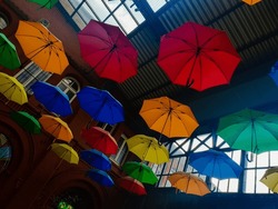 Different umbrellas hanging from the ceiling in Kassel