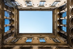Architectural detail of an open courtyard in an ild building in Budapest, Hungary.