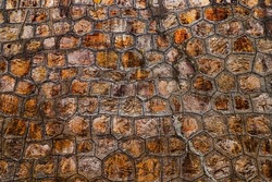 Close up texture of an old and moldy stone wall