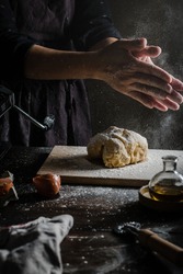 woman's hand knead dough action shot
