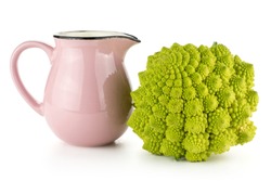 Romanesco cauliflower or broccoli with a pink jar isolated on white background one green head