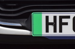 The green strip on a British car front number plate that denotes the car is a zero emissions vehicle