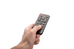 Online tv media control. man hand with modern remote control isolated on white background. remote control from an online media box in a man's hand. digital technology and entertainment concept.