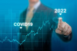 economic recovery in 2022. timeline chart diagram of global economic recovery after crisis caused by covid19 pandemic. Businessman pointing graph growth plan on dark blue. restart economy after crisis