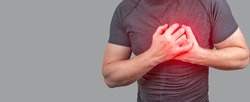heart attack. Man clutching his chest from acute pain. Heart attack symptom. Severe heartache, man suffering from chest pain, having heart attack or painful cramps, pressing on chest
