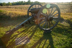 Cannon on Battlefield with Light Halation from Sun