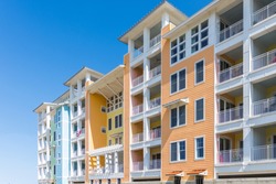 View of high rise apartment or condominium building, bright colors, balconies; Sandbridge Virginia USA