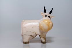 Souvenir figure of a cow made of natural stone.